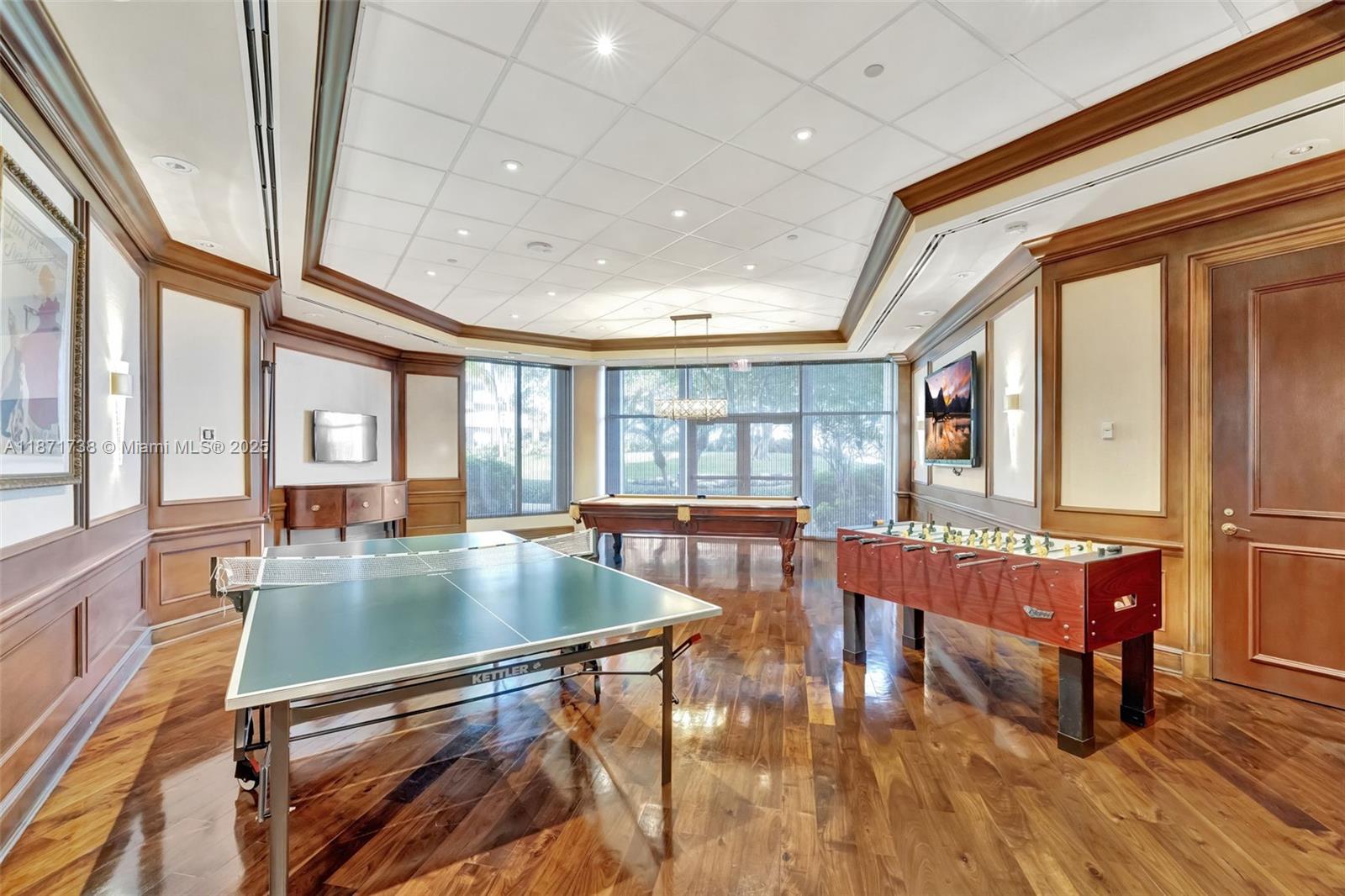 2600 East Island Boulevard, Unit 1503 Aventura, FL 33160 - Photo 35 of 36 a kitchen with stainless steel appliances granite countertop a stove and a large window