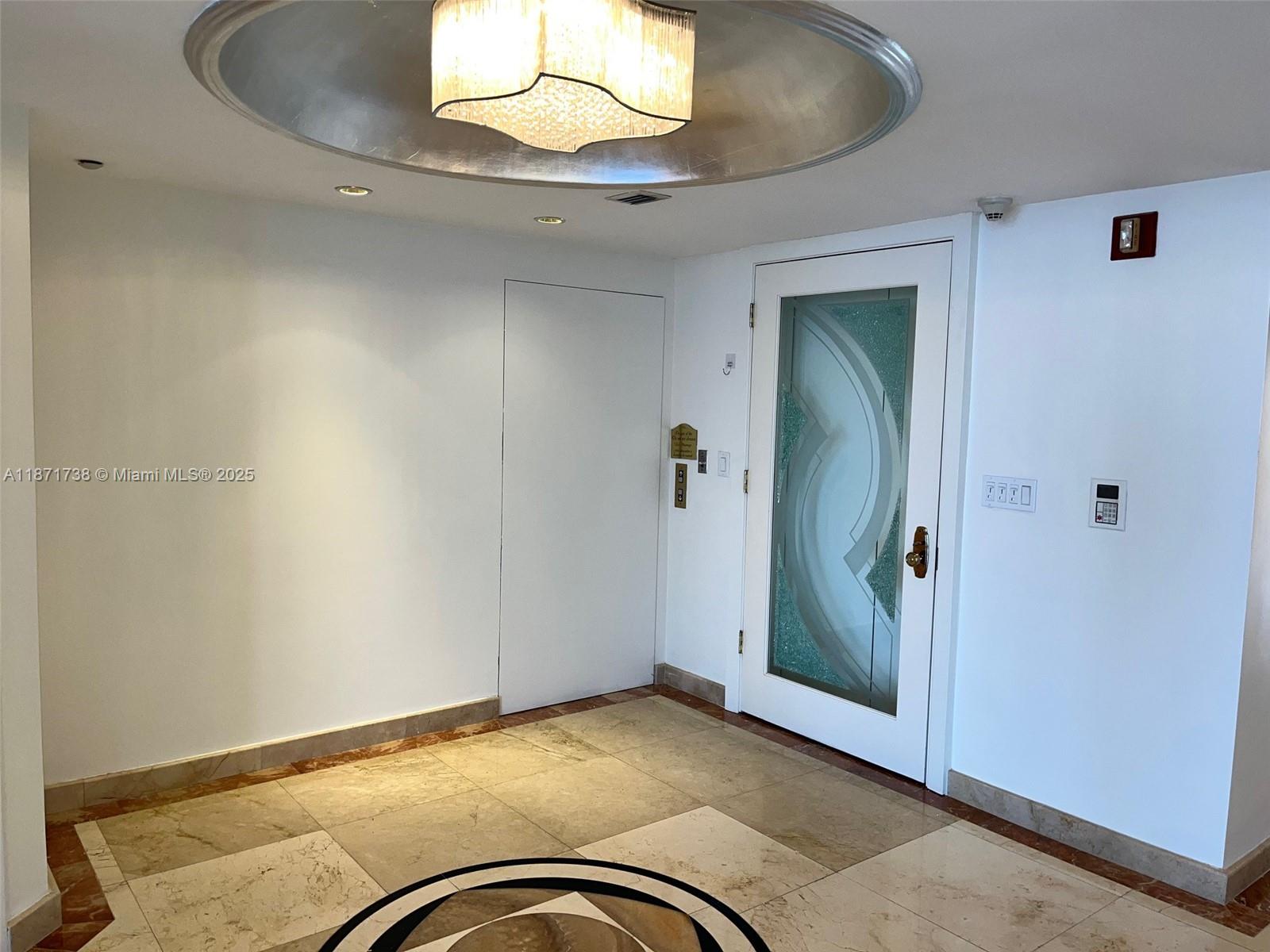 2600 East Island Boulevard, Unit 1503 Aventura, FL 33160 - Photo 4 of 36 a view of a livingroom with a staircase