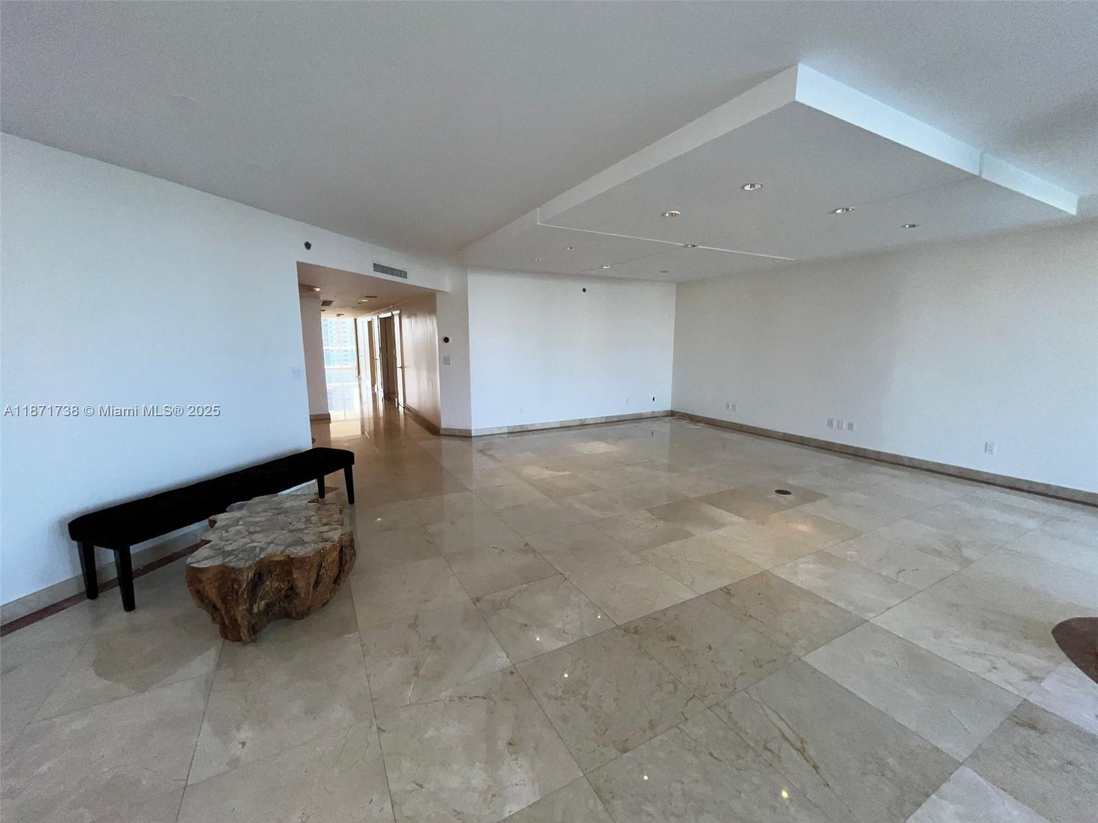 2600 East Island Boulevard, Unit 1503 Aventura, FL 33160 - Photo 5 of 36 an empty room with windows