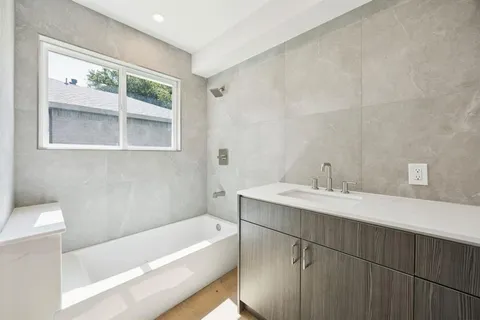 a bathroom with a sink and a bathtub