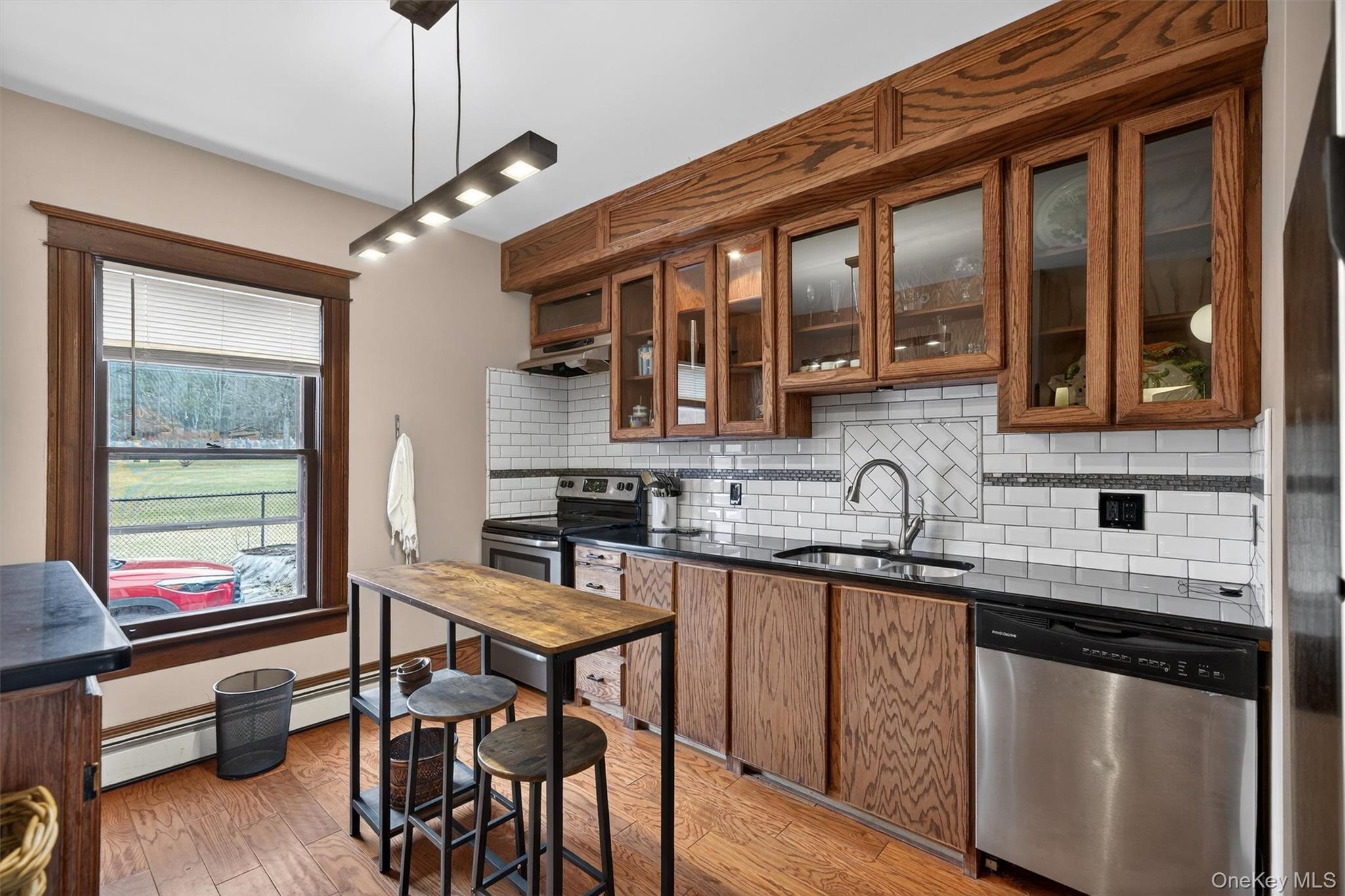 48 Kirks Road Narrowsburg, NY 12764 - Photo 11 of 50 a kitchen with stainless steel appliances granite countertop a stove a sink and a refrigerator