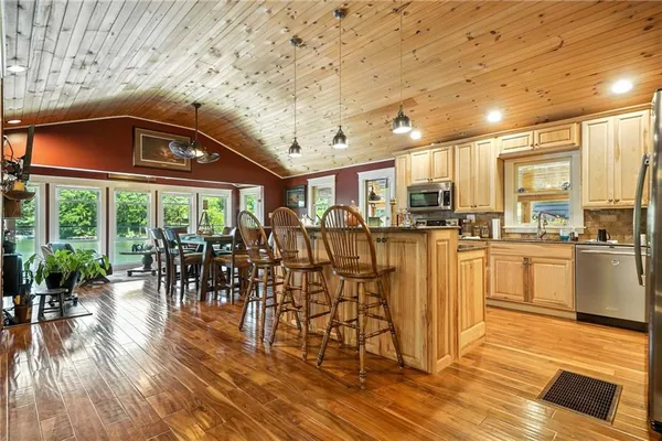 a view of porch with furniture and wooden floor