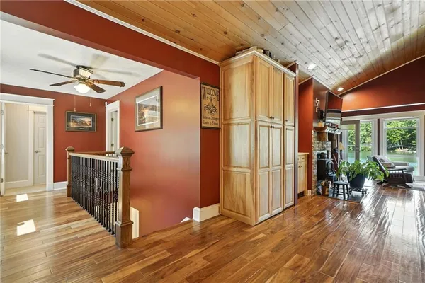 a kitchen with stainless steel appliances granite countertop a stove and cabinets with wooden floor