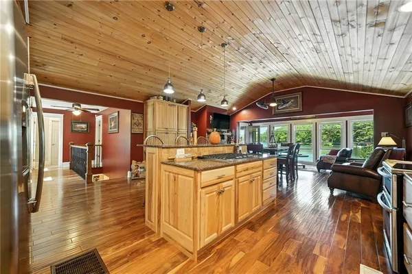 a dining room with furniture window and wooden floor