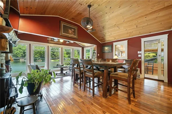 a living room with patio furniture and a potted plants