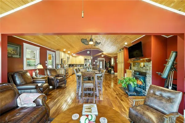 a dining room with furniture and wooden floor