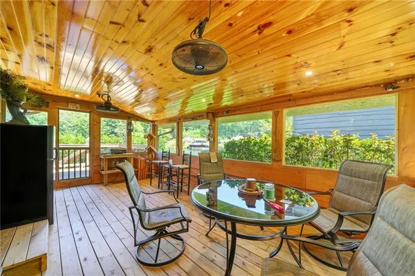 a view of a livingroom with furniture window and wooden floor