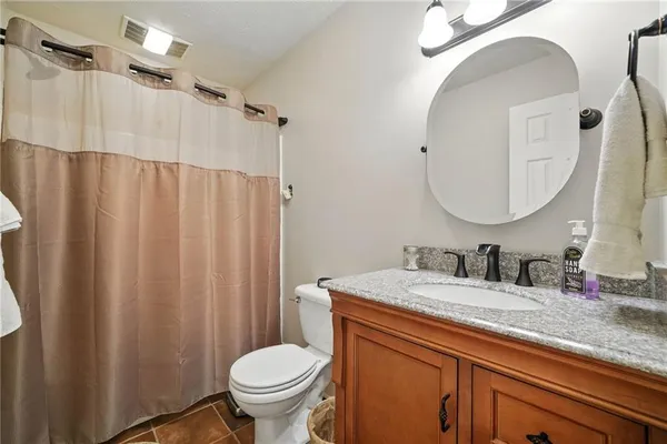 a bedroom with a bed and dresser