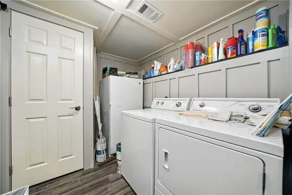 a bathroom with a sink toilet and mirror
