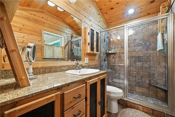 a view of a livingroom with furniture and a fireplace