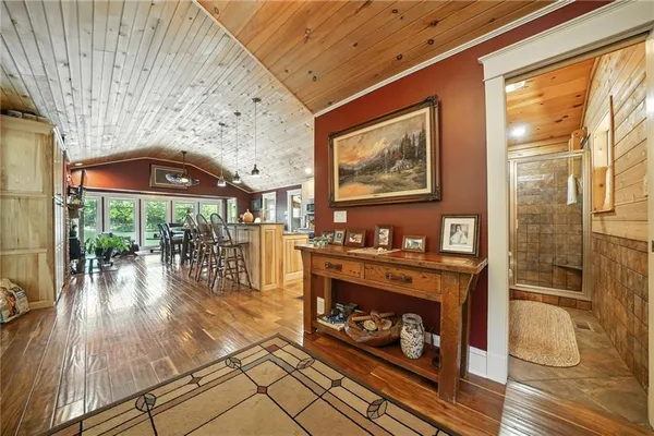 a very nice looking room with a large window and wooden floor