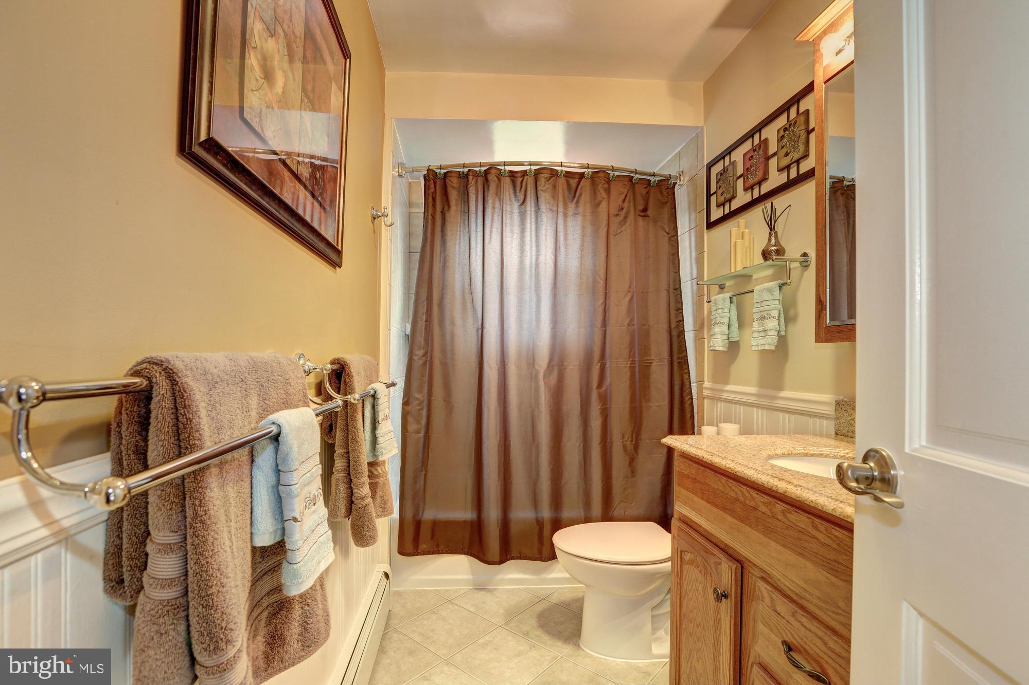 16921 Oak Hill Road Silver Spring, MD 20905 - Photo 17 of 30 Lovely hall bath with ceramic tile and beadboard