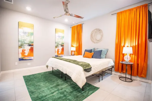 a bedroom with a bed and window