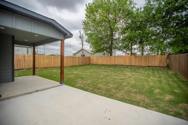a view of a backyard of the house