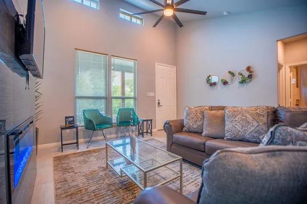 a living room with furniture and a flat screen tv