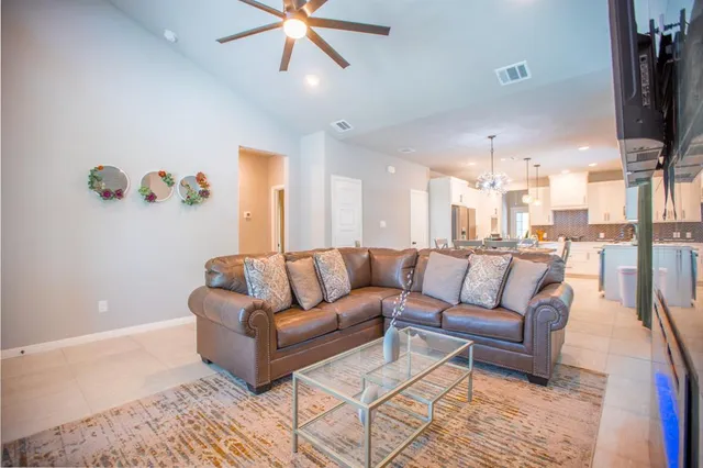 a view of a living room a livingroom with furniture and a flat screen tv