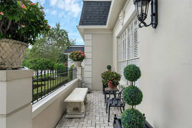 a balcony with plants and flowers