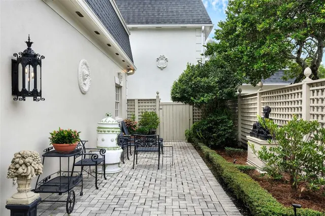 a view of a porch with furniture and a potted plant