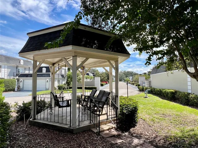 a view of a chairs and tables in the patio