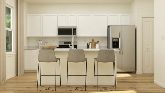 a kitchen with a sink appliances and cabinets
