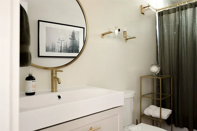 a bathroom with a shower and a sink