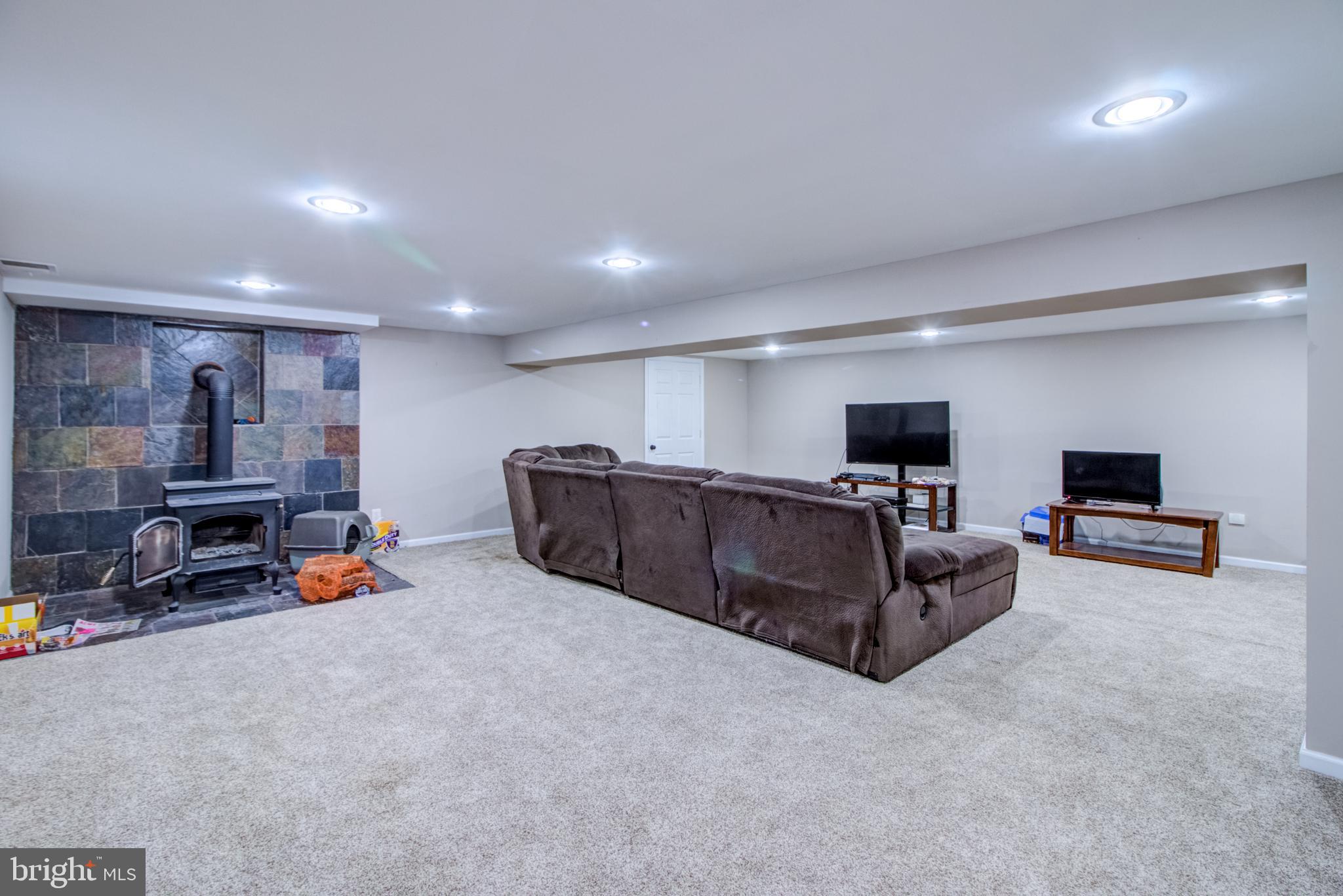 18 Assiscunk Drive Columbus, NJ 08022 - Photo 23 of 36 Finished Basement Wood Stove/ TV Area