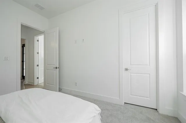 a view of walk in closet with clothes