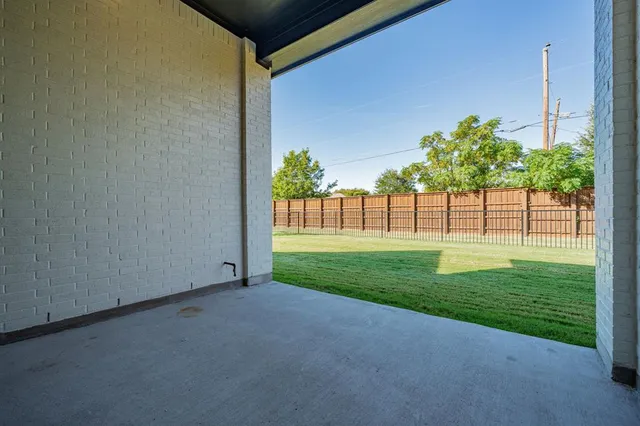 a large bed sitting in a bedroom next to a window