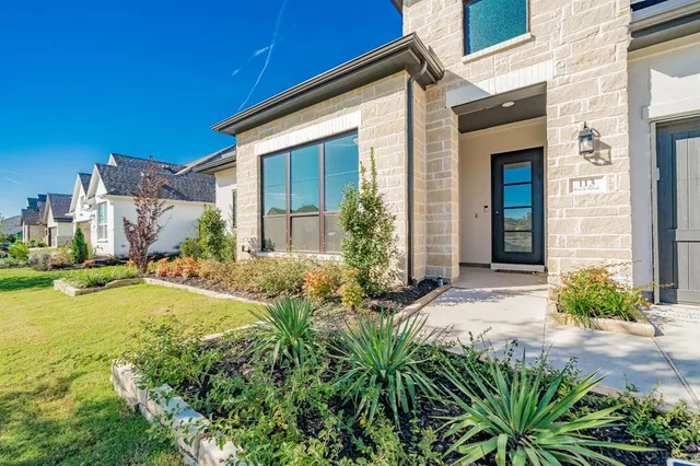 a view of a backyard with a garden