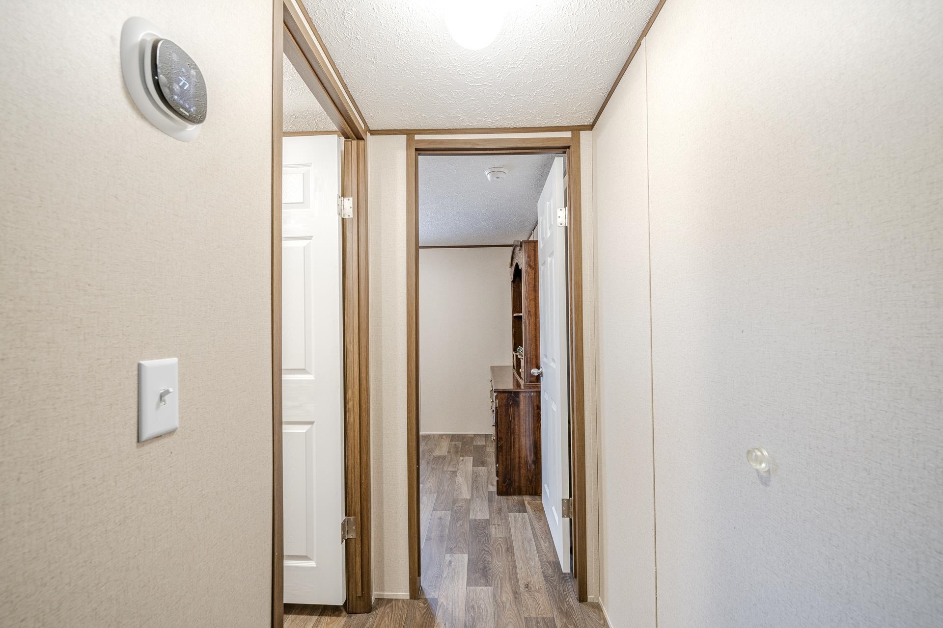 3275 Glendale Road Adamsville, TN 38310 - Photo 24 of 39 a view of a hallway with wooden floor