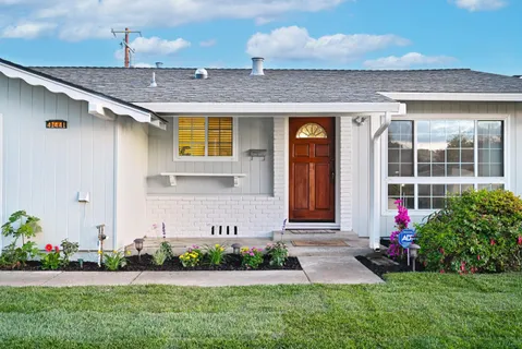 a front view of house with yard and green space