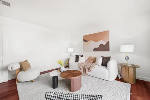 a living room with furniture and a lamp