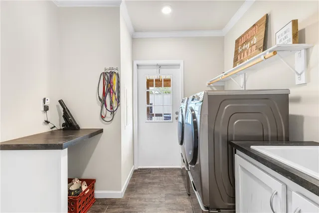 a view of a storage and utility room with a washer dryer