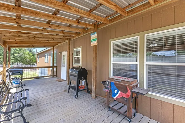 a view of a chair and couch in the balcony