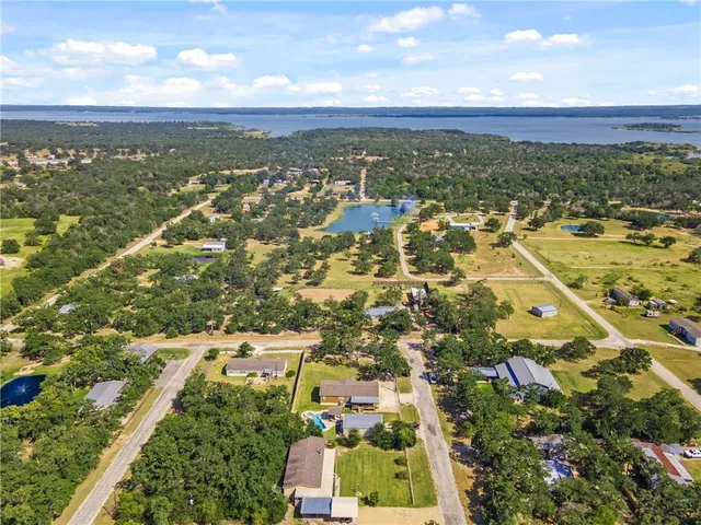 an aerial view of residential building and ocean view