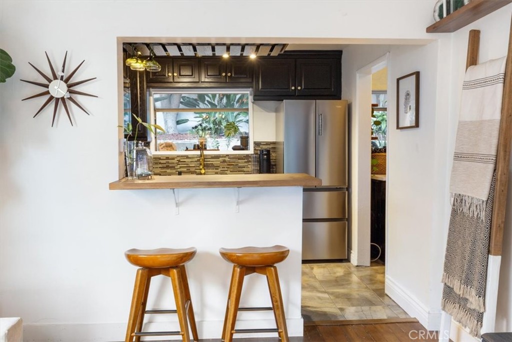 2207-2009 Apex Avenue Los Angeles, CA 90039 - Photo 13 of 64 Bar stools next to the pennisula. This butcher block counter space is a great sitting area for a quick breakfast or some wine & conversation while cooking
