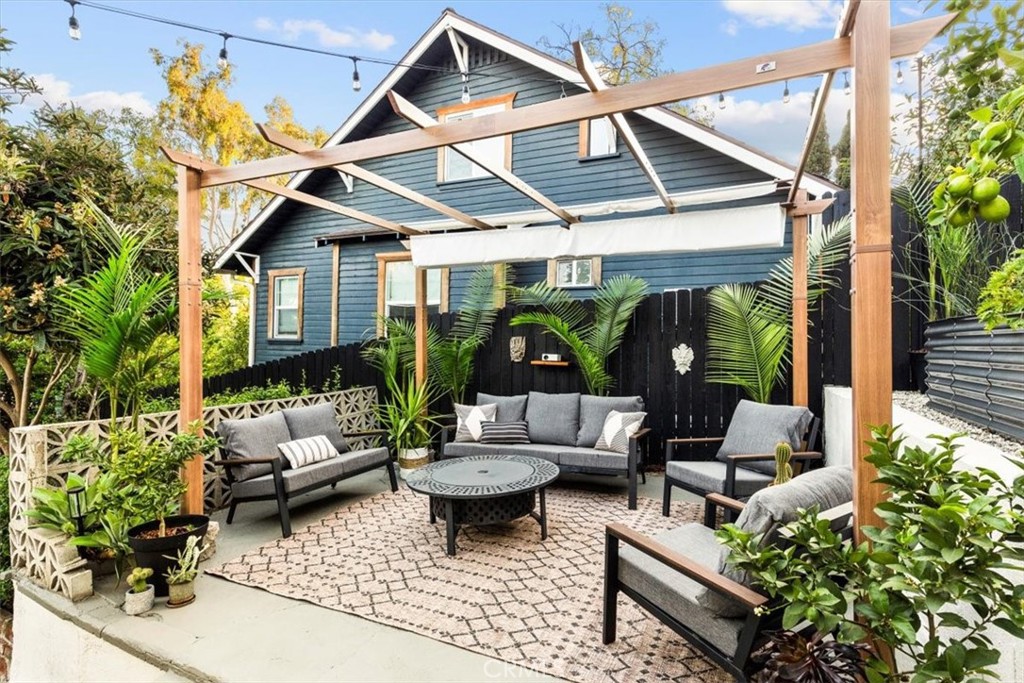2207-2009 Apex Avenue Los Angeles, CA 90039 - Photo 28 of 64 The fire pit area serves as a great place to gather for drinks over a wood burning fire pit or watch an outdoor movie with the projector.