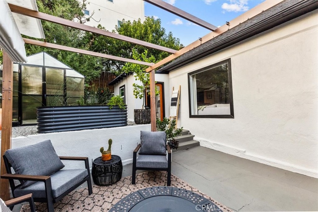 2207-2009 Apex Avenue Los Angeles, CA 90039 - Photo 29 of 64 The green house to the left was a recent addition to the property and the white wall against the home with the perfect screen for a movie night through a 4K projector.