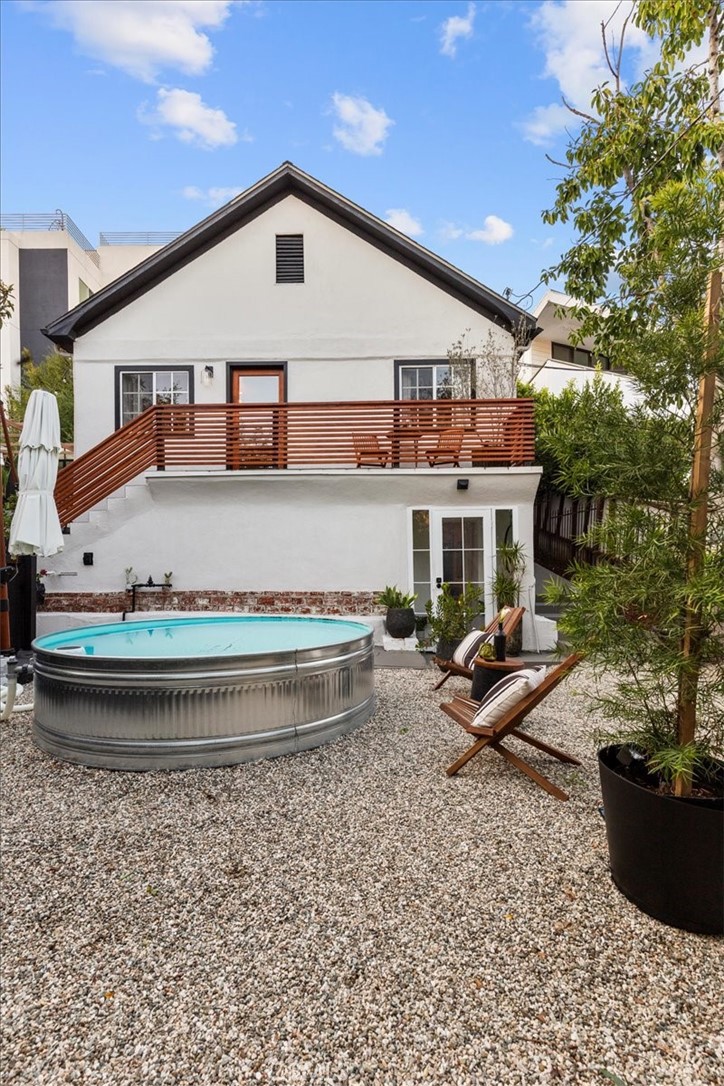 2207-2009 Apex Avenue Los Angeles, CA 90039 - Photo 34 of 64 A view from inside the black wooden fence to the front of the home.
