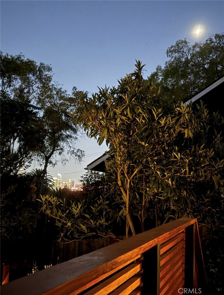 2207-2009 Apex Avenue Los Angeles, CA 90039 - Photo 48 of 64 New amber colored horizontal wood stair rails add a beautiful balance and zen feature to the modernized cottage-style home.
