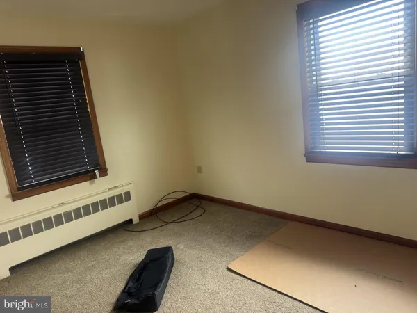 a view of an empty room and a window