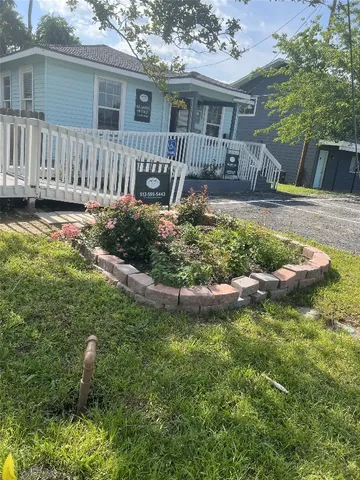 a front view of a house with garden