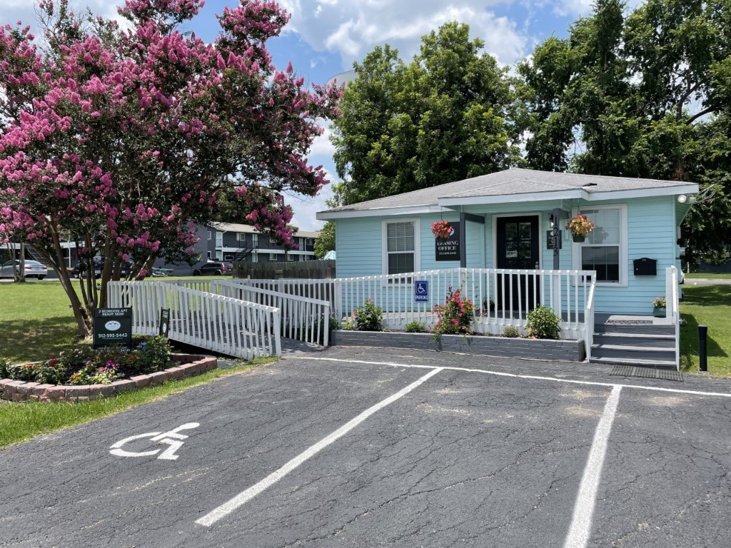 1209 Vance Street, Unit 30 Taylor, TX 76574 - Photo 21 of 35 a front view of a house with a yard