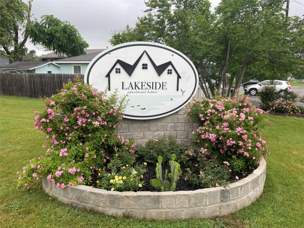 1209 Vance Street, Unit 30 Taylor, TX 76574 - Photo 25 of 35 a view of a sign board with flower garden