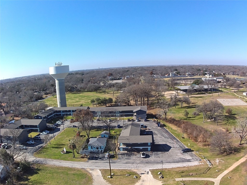 1209 Vance Street, Unit 30 Taylor, TX 76574 - Photo 3 of 35 a view of a city with lawn chairs