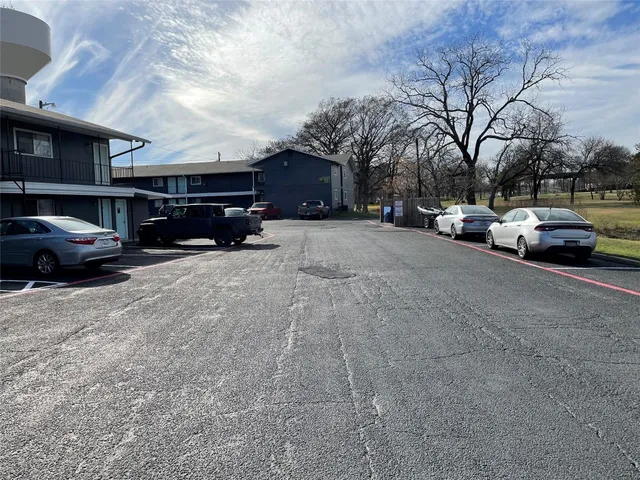 a view of street with parked cars