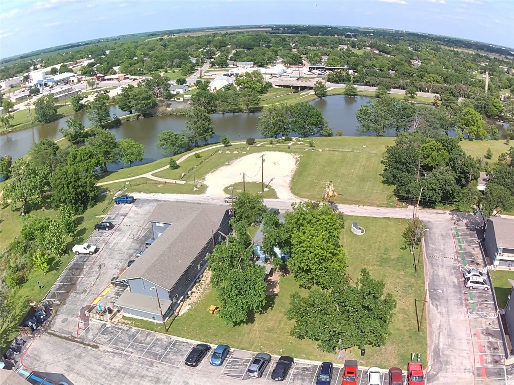1209 Vance Street, Unit 30 Taylor, TX 76574 - Photo 4 of 35 an aerial view of residential houses with outdoor space and river