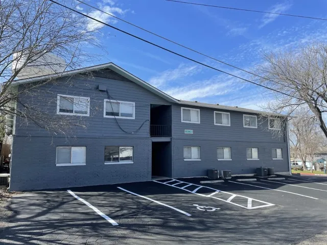 a front view of residential houses with yard