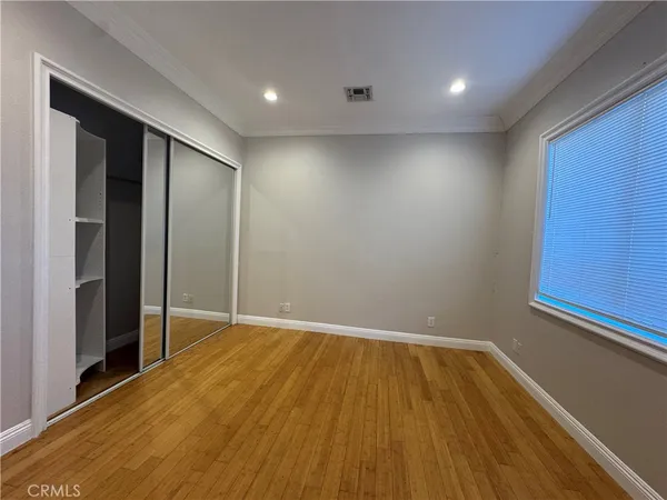 a view of hallway with wooden floor