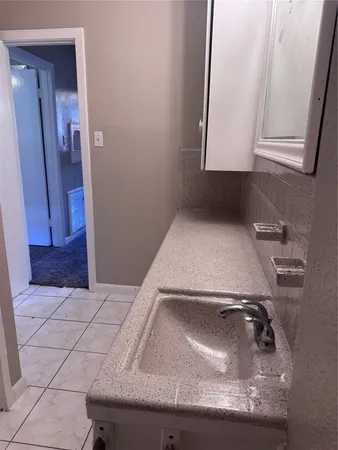 a bathroom with a sink and a toilet